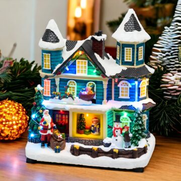 Casa con Babbo Natale con slitta in movimento a batteria 20xH23cm